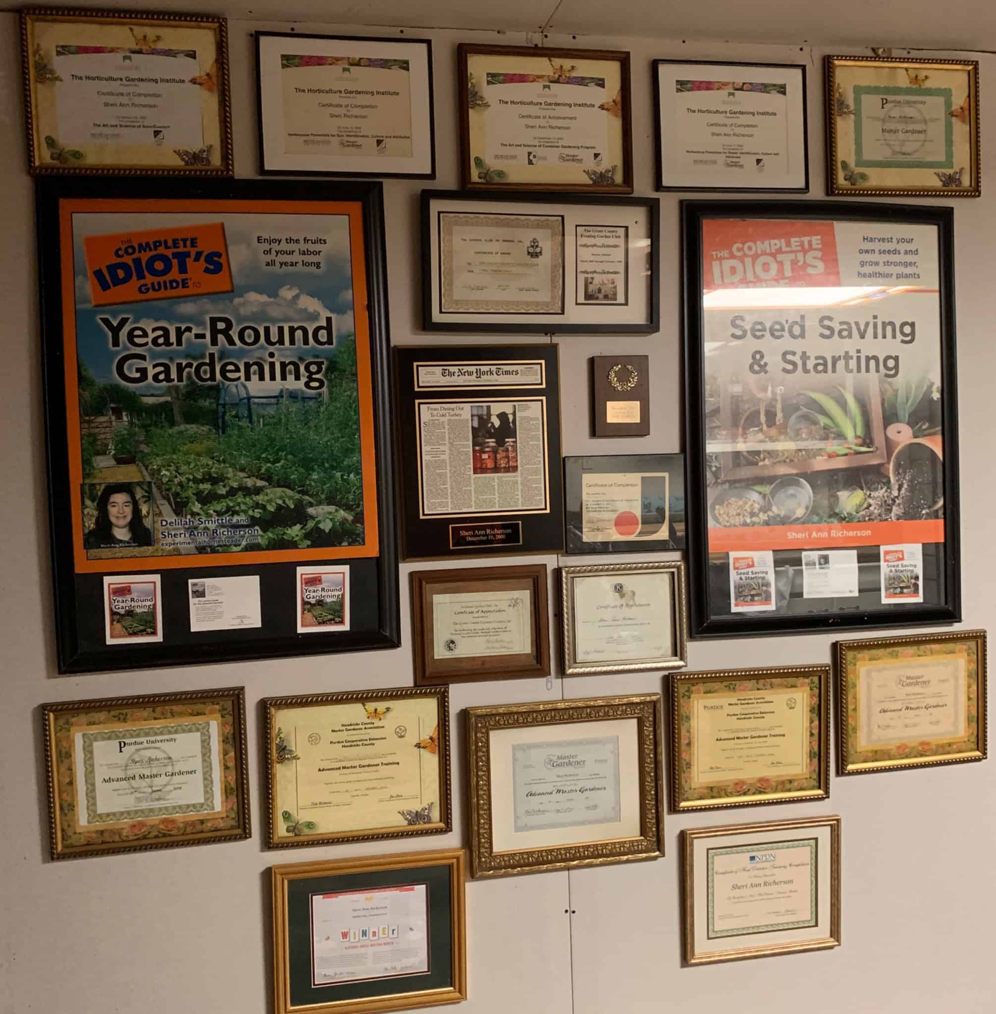 Wall displaying Sheri Ann Richerson's gardening credentials, awards and traditionally published gardening books.