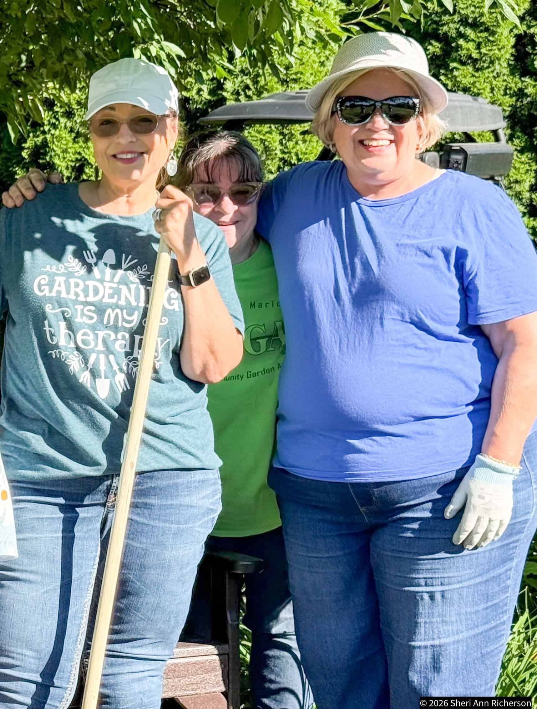 Sheri Ann Richerson and Garden Club of Marion members working at the Memorial Garden at Matter Park in Marion, Indiana.