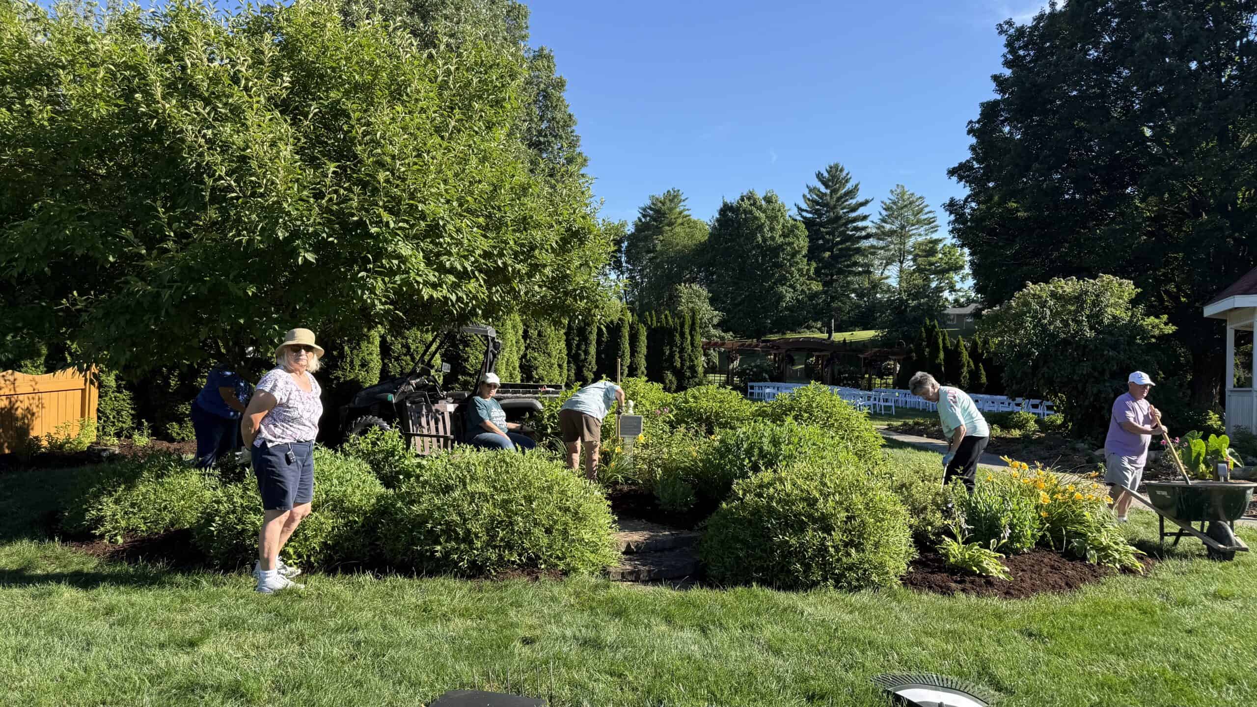 Sheri Ann Richerson spreading mulch while working at the Memorial Garden at Matter Park in Marion, Indiana.